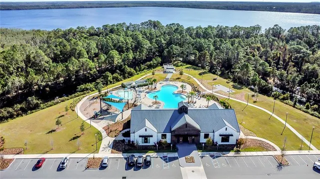 an aerial view of a house with a swimming pool