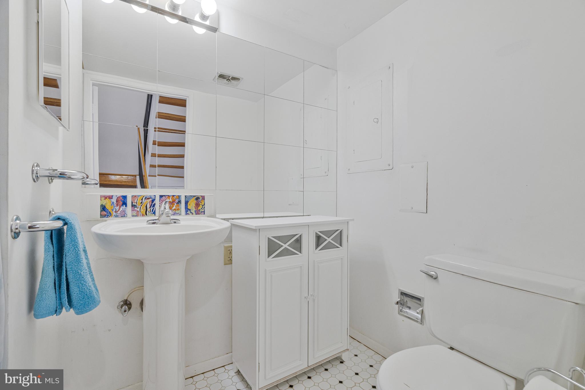 1353 Northgate Square Reston, VA 20190 - Photo 14 of 26 Lower level half bath with tile flooring