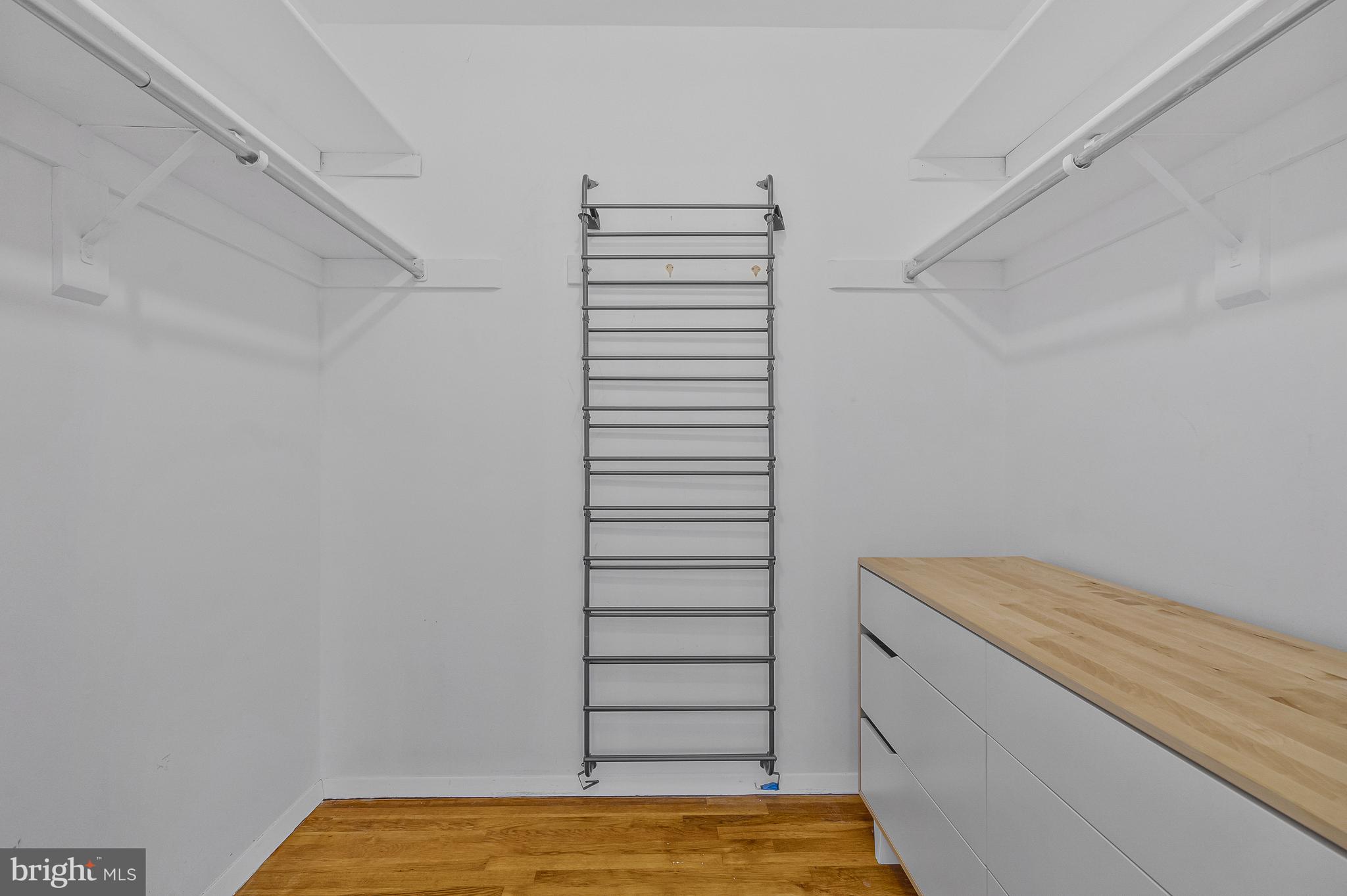 1353 Northgate Square Reston, VA 20190 - Photo 17 of 26 Walk-in closet in primary bedroom