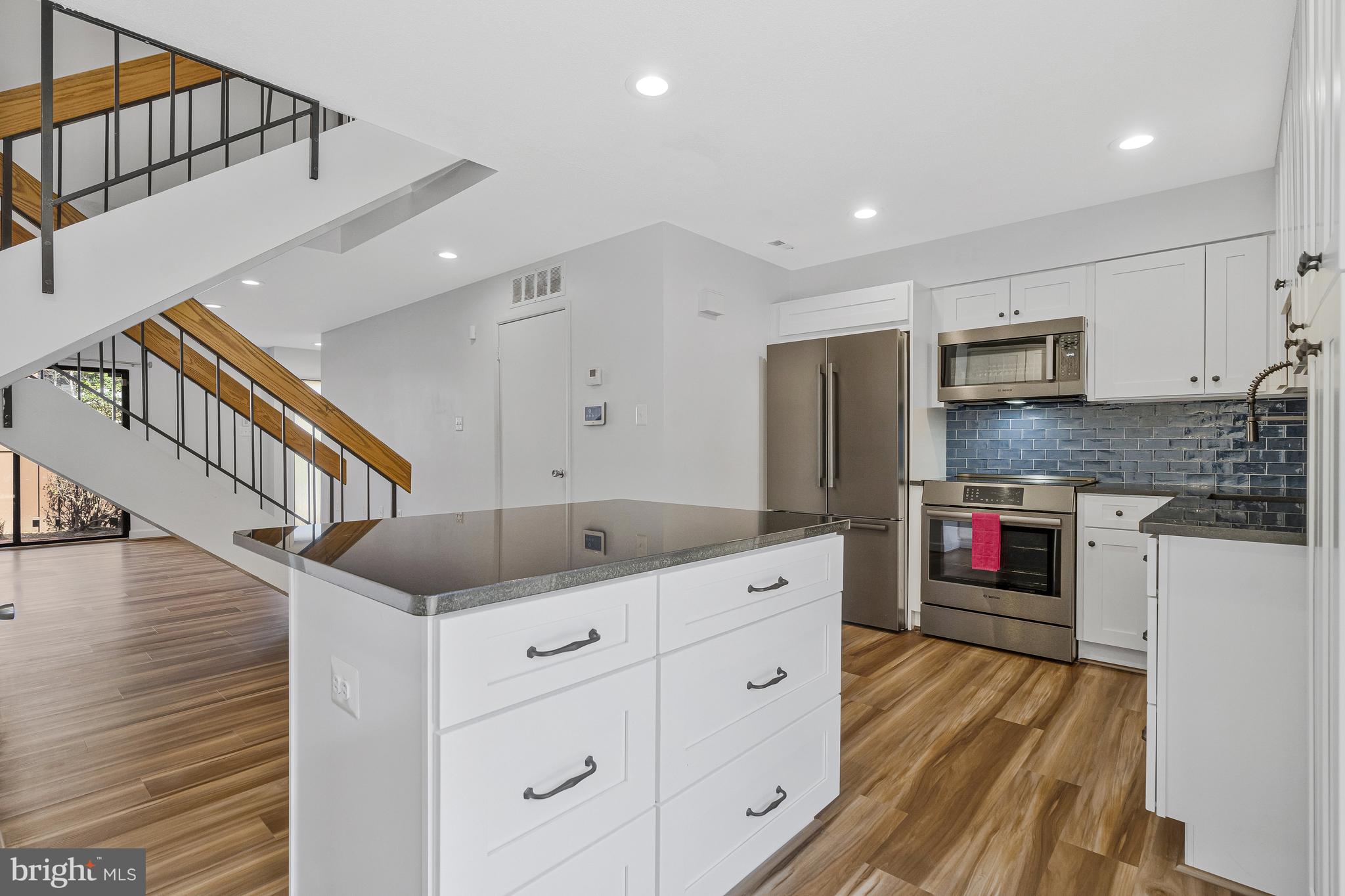 1353 Northgate Square Reston, VA 20190 - Photo 9 of 26 Center island and attractive backsplash