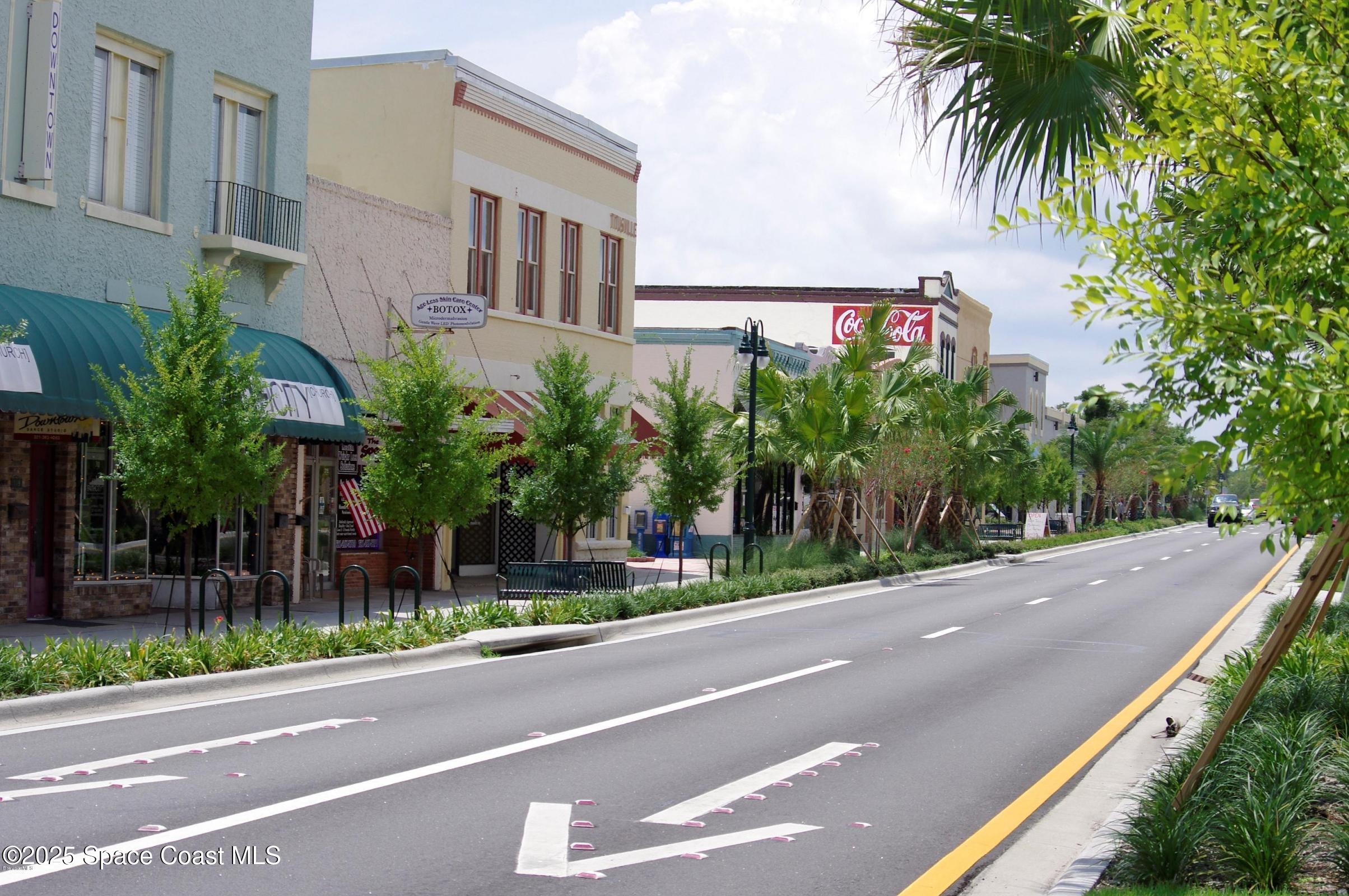 3548 Loggerhead Lane Mims, FL 32754 - Photo 20 of 25 a view of a street with a building in front of it