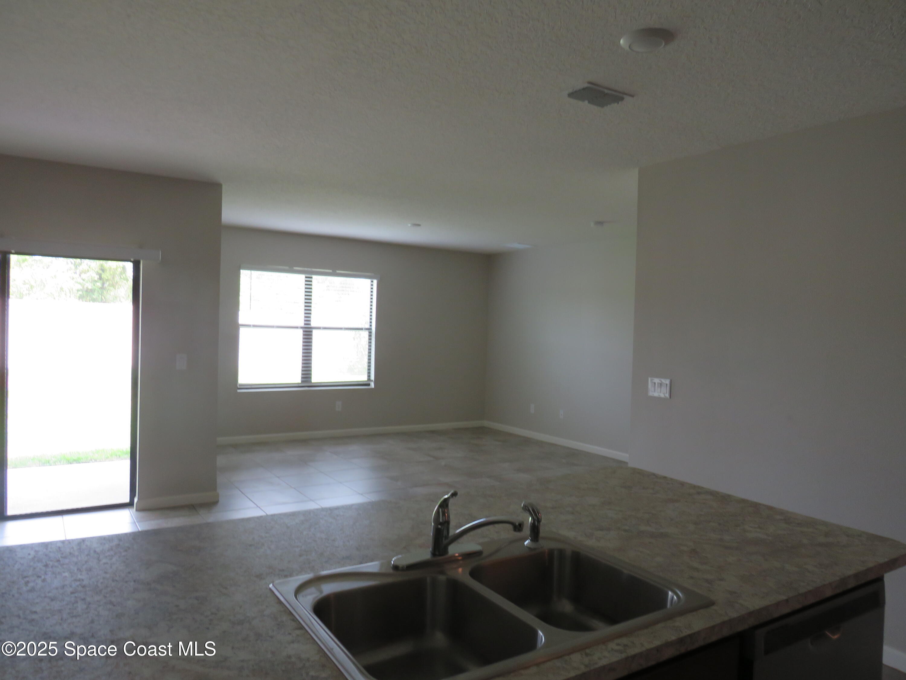 3548 Loggerhead Lane Mims, FL 32754 - Photo 5 of 25 a kitchen with a sink and cabinets