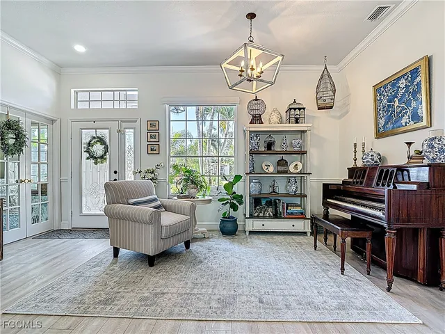 a living room with fireplace furniture and a window
