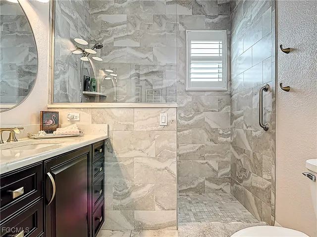 a bathroom with a sink and mirror