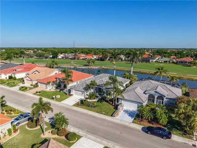 an aerial view of a house with a lake view