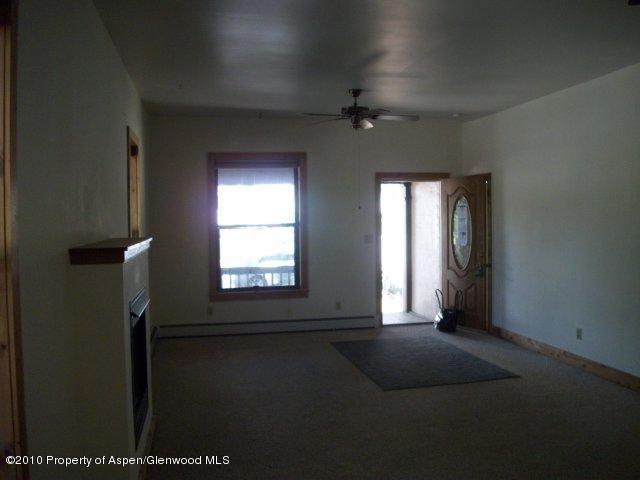 303 East 3rd Street Rifle, CO 81650 - Photo 3 of 8 a view of empty room with window