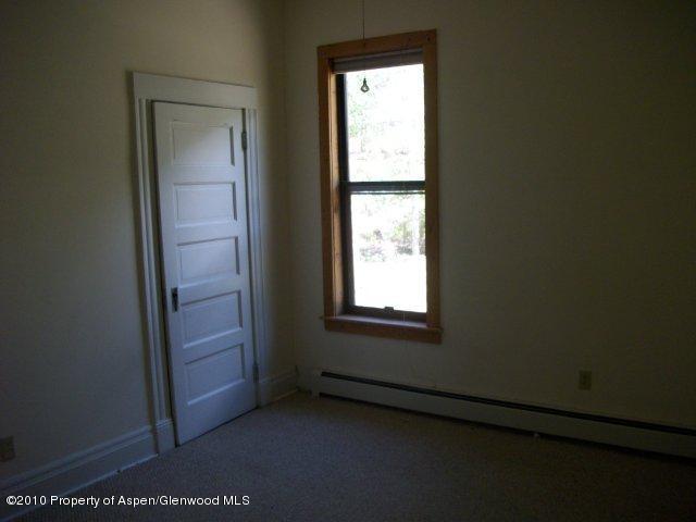 303 East 3rd Street Rifle, CO 81650 - Photo 5 of 8 an empty room with windows