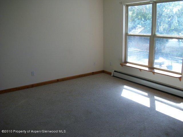 303 East 3rd Street Rifle, CO 81650 - Photo 8 of 8 an empty room with a window