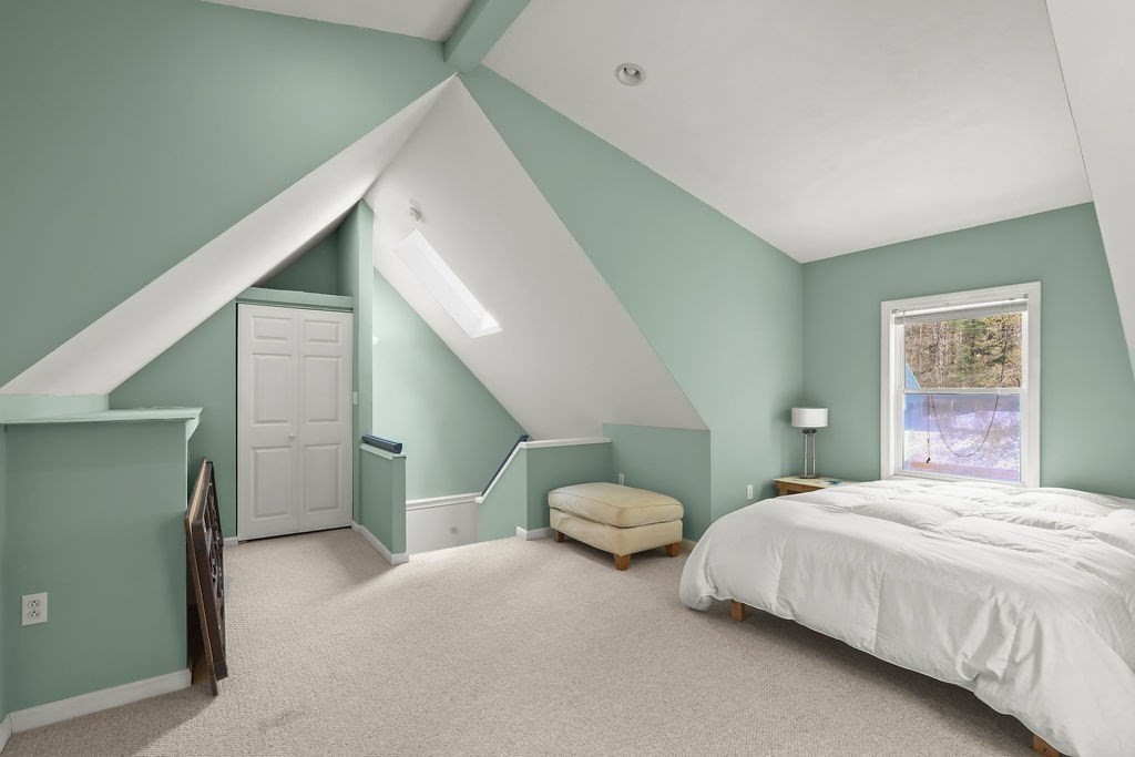 94 Fearing Hill Road Wareham, MA 02576 - Photo 29 of 41 a bedroom with a bed and a painting on the wall