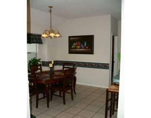 5113 Cavendish Drive Corpus Christi, TX 78413 - Photo 3 of 7 a dining room with furniture and chandelier