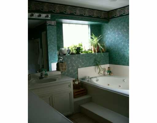 5113 Cavendish Drive Corpus Christi, TX 78413 - Photo 6 of 7 a bathroom with a sink and a mirror