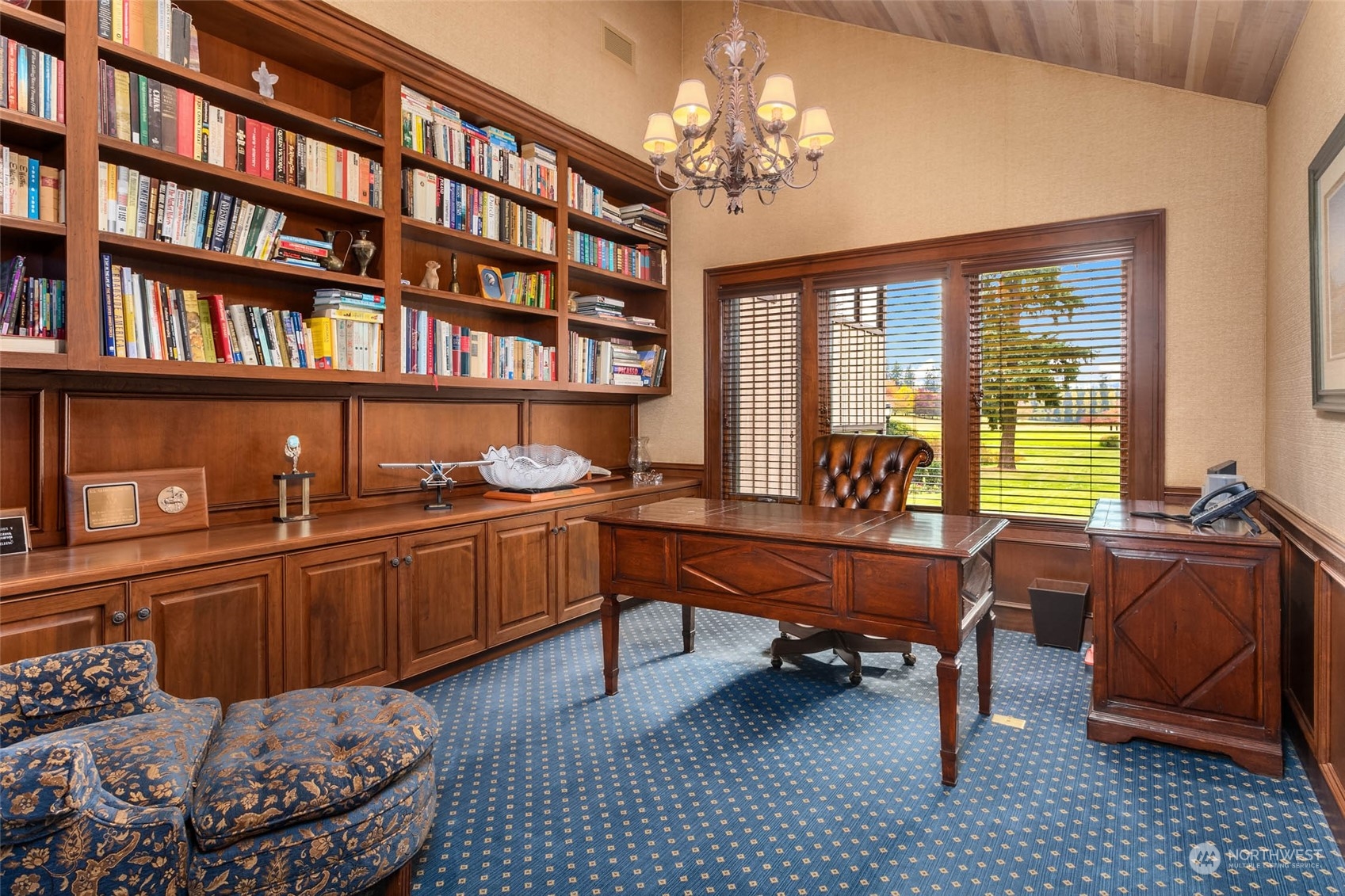 12011 Southwest 220th Street Vashon, WA 98070 - Photo 20 of 40 a living room with furniture a rug and a bookshelf