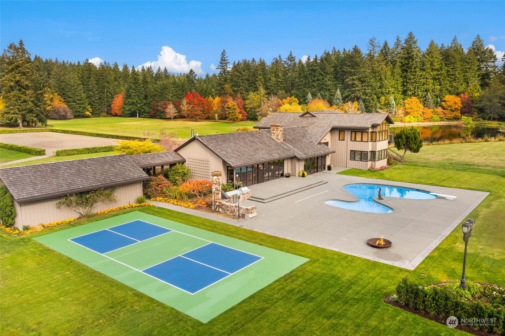 12011 Southwest 220th Street Vashon, WA 98070 - Photo 3 of 40 a view of an house with pool and a yard