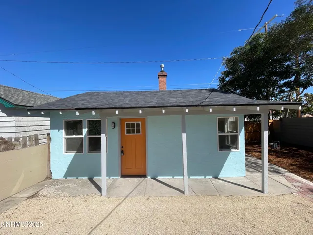 a view of workspace with window and wooden floor