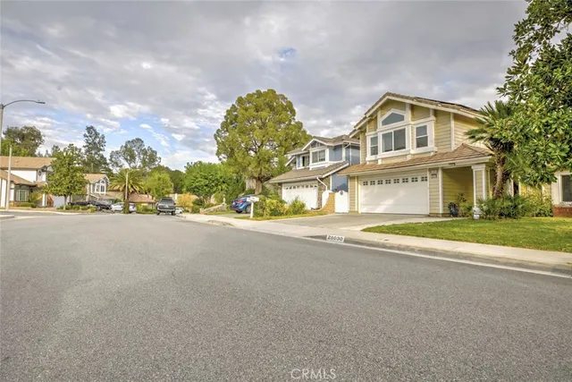 a view of staircase with white walls and railing