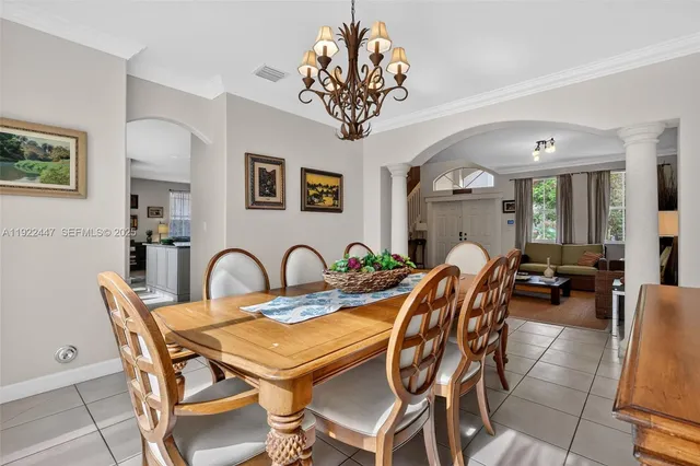 a kitchen with stainless steel appliances granite countertop a refrigerator sink stove and cabinets