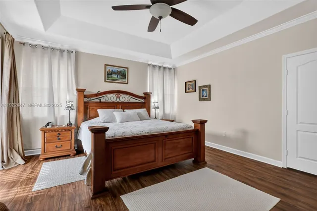 a view of a patio with a table and chairs under an umbrella