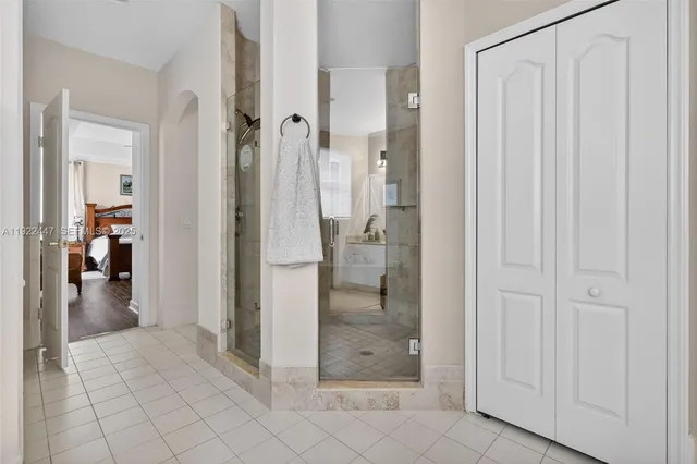 an aerial view of residential houses with outdoor space and trees