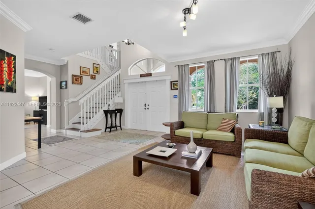 a view of a dining room with furniture and window