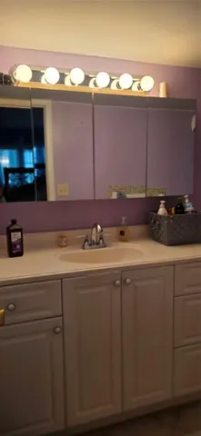a sink with a stove and cabinets