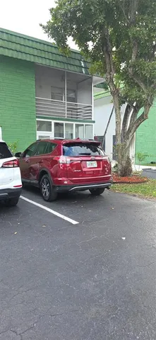 a front view of a house with parking space