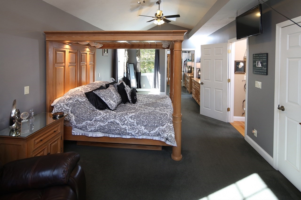 40 Lazel Street Whitman, MA 02382 - Photo 11 of 20 a large bedroom with a large bed and a large window