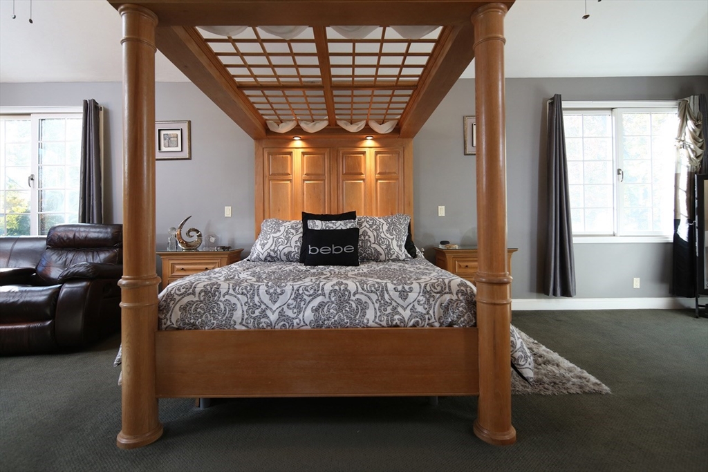 40 Lazel Street Whitman, MA 02382 - Photo 12 of 20 a bedroom with a bed and wooden floor