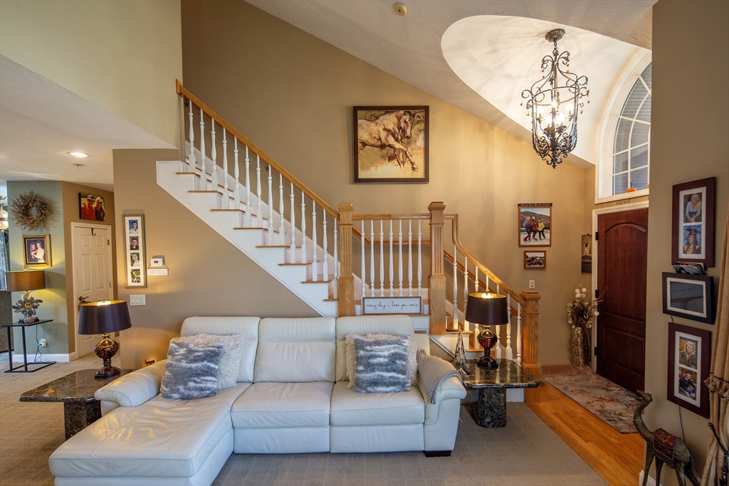 40 Lazel Street Whitman, MA 02382 - Photo 4 of 20 a living room with furniture and a chandelier