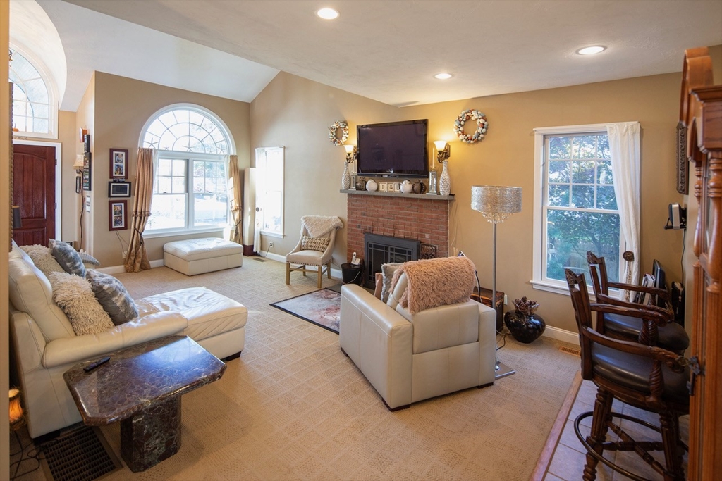 40 Lazel Street Whitman, MA 02382 - Photo 6 of 20 a living room with furniture fireplace and a flat screen tv