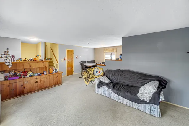 a bed room with furniture and a window