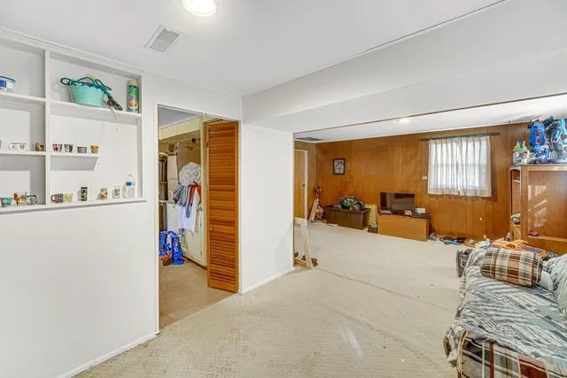 a bed room with furniture and a window