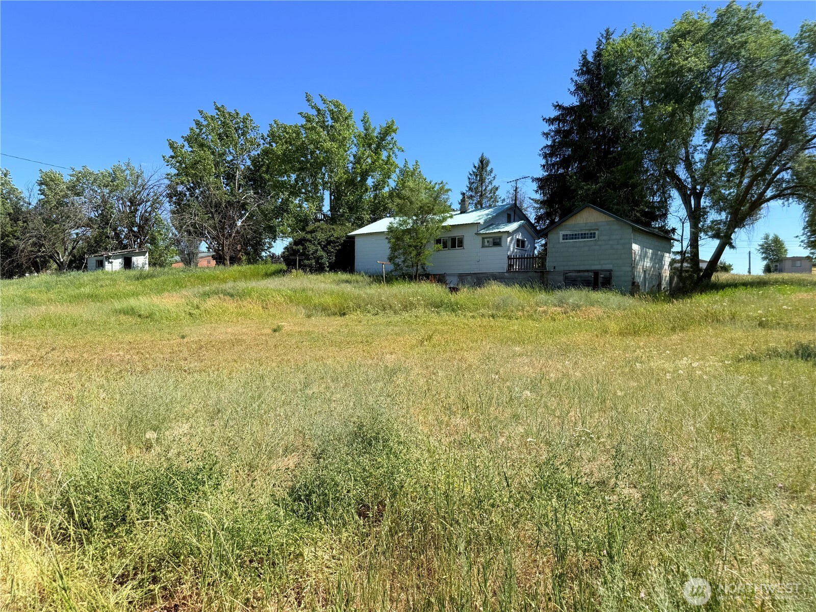 150 Southwest South 1st Creston, WA 99117 - Photo 20 of 22 a backyard of a house with table and chairs