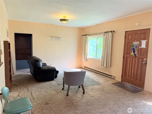 a living room with furniture and a window