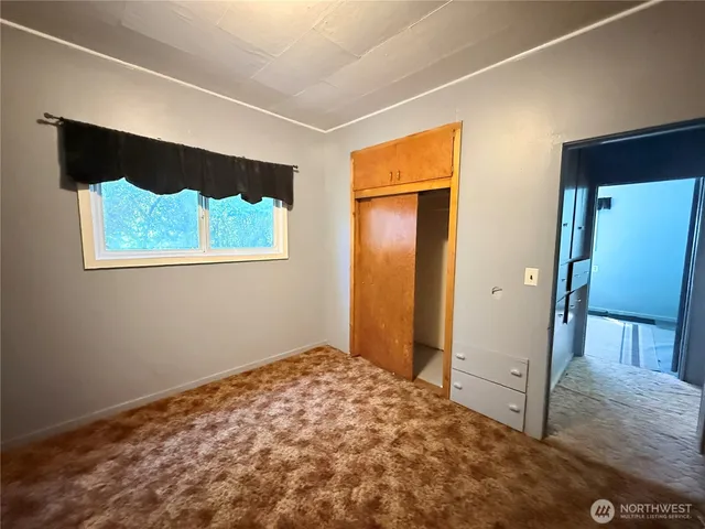 a view of a hallway with a bedroom