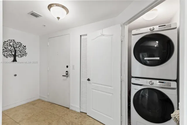 a view of a hallway with washer and dryer