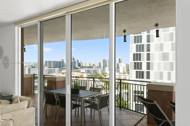 a view of a balcony dining table and chairs