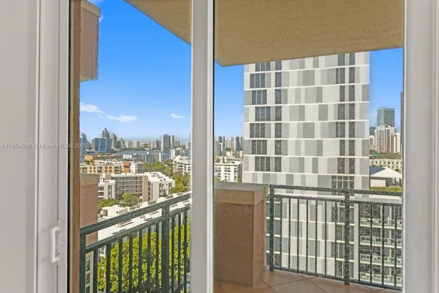a view of a balcony with a floor to ceiling window