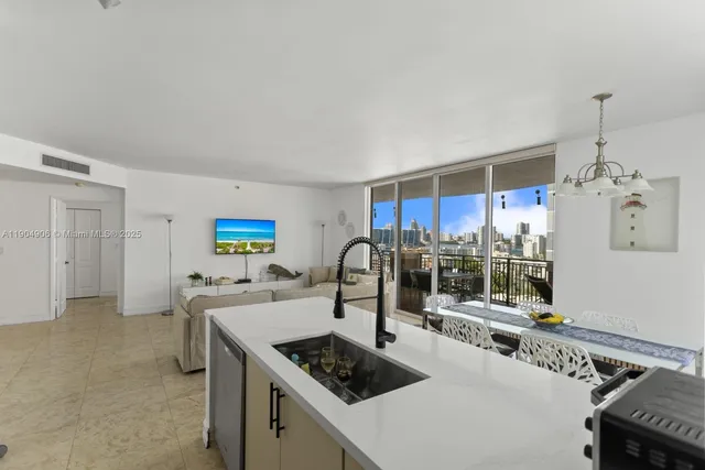 a kitchen with stainless steel appliances granite countertop a sink and cabinets