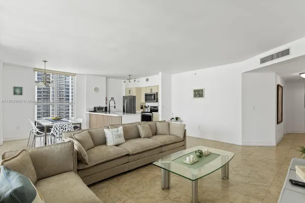 a living room with furniture and a table