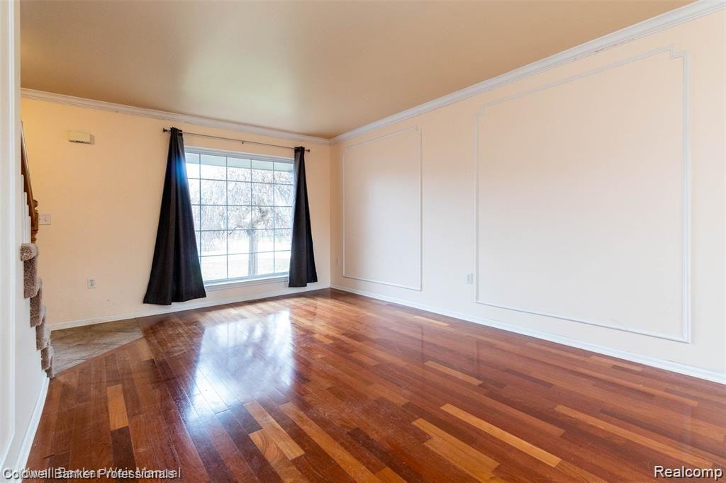 8263 Jeremy Road Belleville, MI 48111 - Photo 9 of 29 Versatile Living Room/Dining Room with hardwood floors