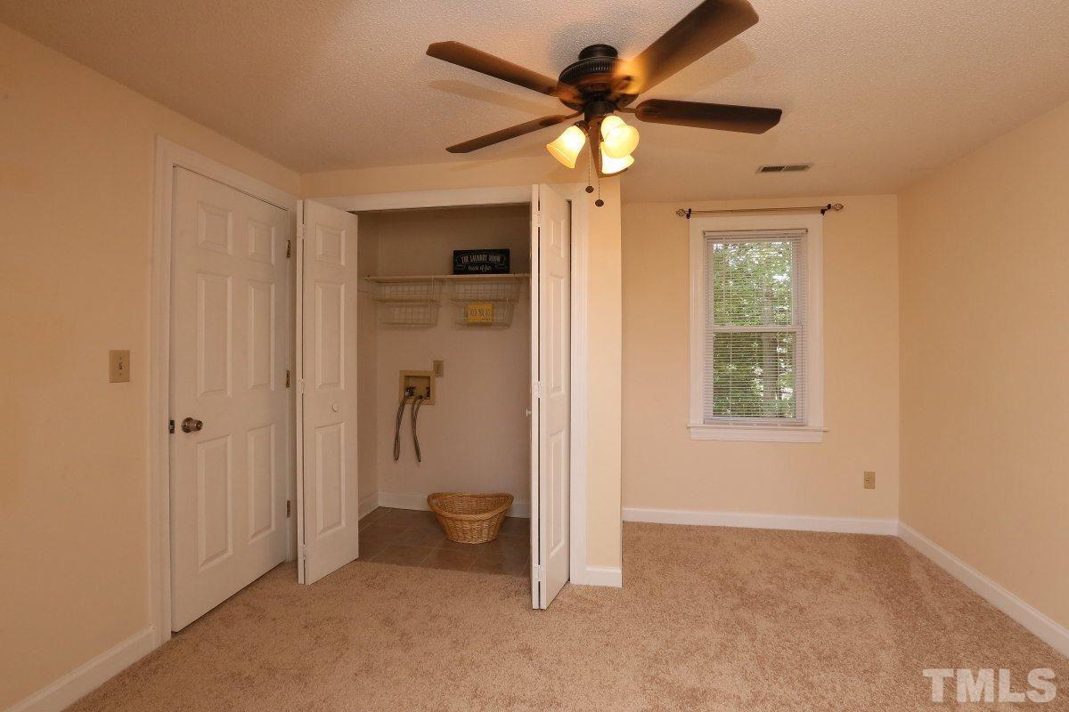 3809 Old Coach Road Raleigh, NC 27616 - Photo 17 of 25 an empty room and chandelier fan