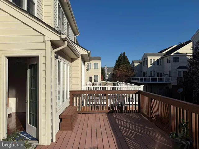 a view of a house with wooden deck