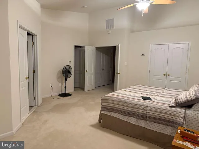 a bedroom with a bed and a cabinets