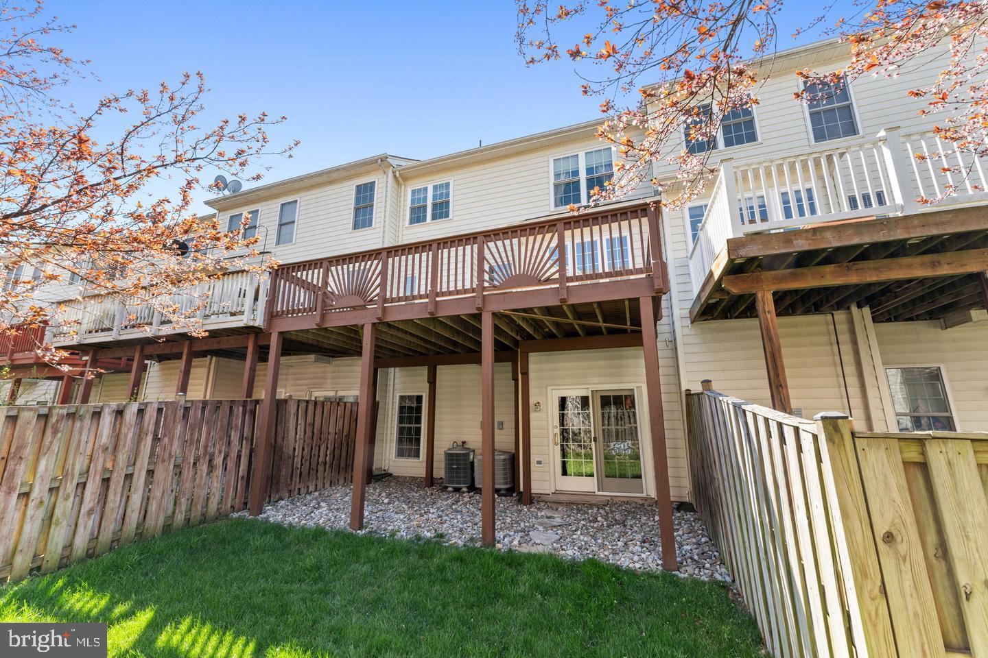 25210 Whippoorwill Terrace Chantilly, VA 20152 - Photo 33 of 33 a view of a house with a yard and wooden deck