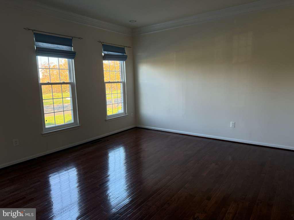 25210 Whippoorwill Terrace Chantilly, VA 20152 - Photo 5 of 33 an empty room with wooden floor and windows