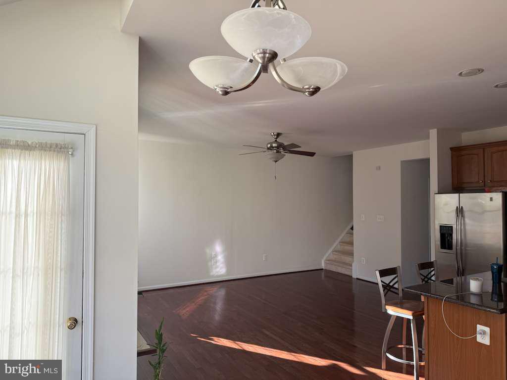 25210 Whippoorwill Terrace Chantilly, VA 20152 - Photo 9 of 33 a room with wooden floor and windows