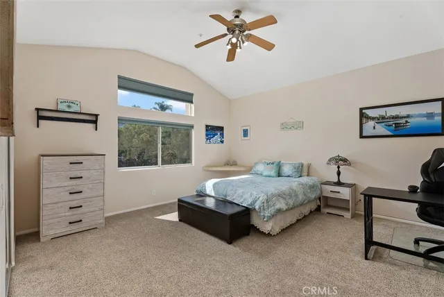 a living room with a bed furniture and a window