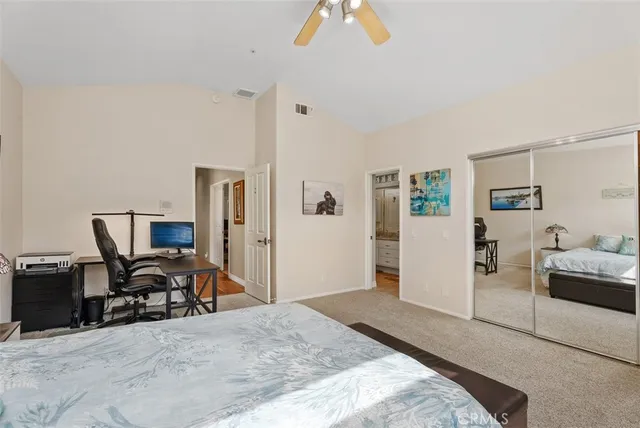a bedroom with furniture and a window