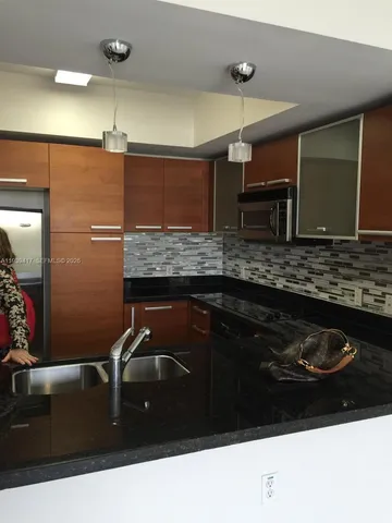 a bathroom with a sink a vanity and a mirror