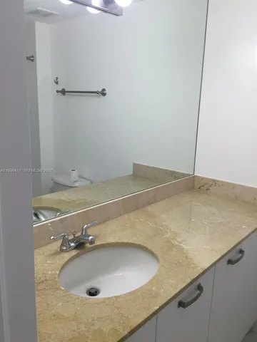 a bathroom with a sink and a vanity